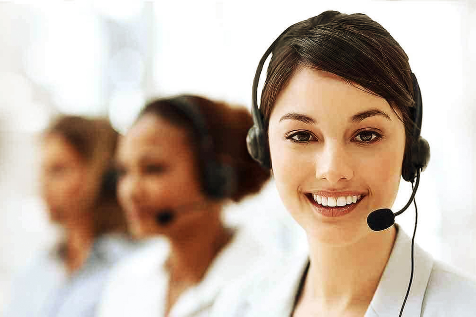 Smiling female phone counsellor from a service company